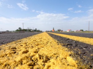 Fresh paint on an asphalt road has been put down on Western Ave. between 149th and 164th Street in Norman, OK.